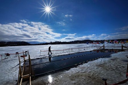 Totally cold' is not too cold for winter swimmers competing in a frozen  Vermont lake