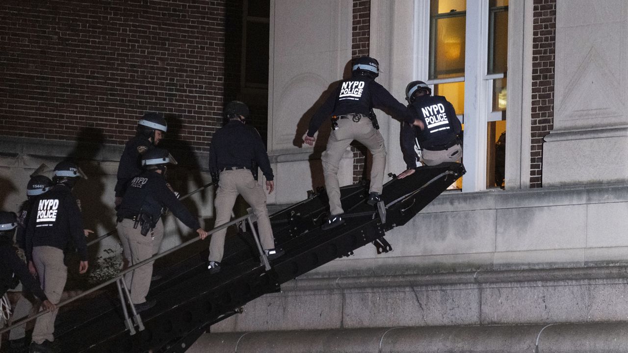 New York City police enter an upper floor of Hamilton Hall on the Columbia University campus using a tactical vehicle on Tuesday, April 30, 2024, after the building was taken over by protesters. (AP Photo/Craig Ruttle)