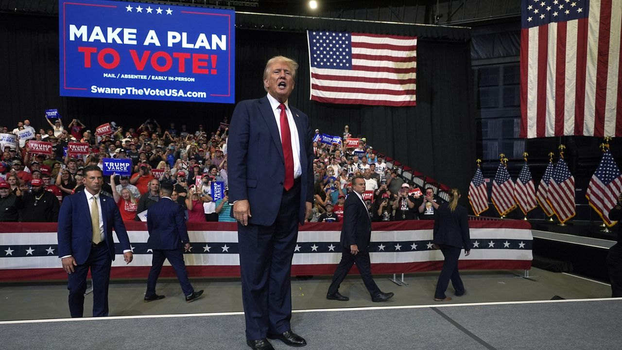 Republican presidential nominee former President Donald Trump talks after speaking at a campaign rally in Bozeman, Mont., Friday, Aug. 9, 2024. (AP Photo/Rick Bowmer)