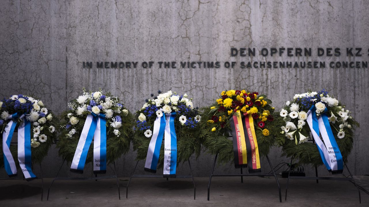 Wreaths at the memorial wall of the Nazi concentration camp Sachsenhausen after a ceremony marking the Holocaust Martyrs' and Heroes' Remembrance Day in Oranienburg, Germany, Tuesday, April 18, 2023. (AP Photo/Markus Schreiber)
