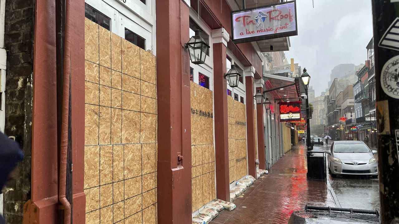 Boarded windows and sandbags cover the windows of a Bourbon Street bar in New Orleans' French Quarter, Wednesday, Sept. 11, 2024, as the city was bracing for high winds and possible flooding as Hurricane Francine approached Louisiana's coast. 