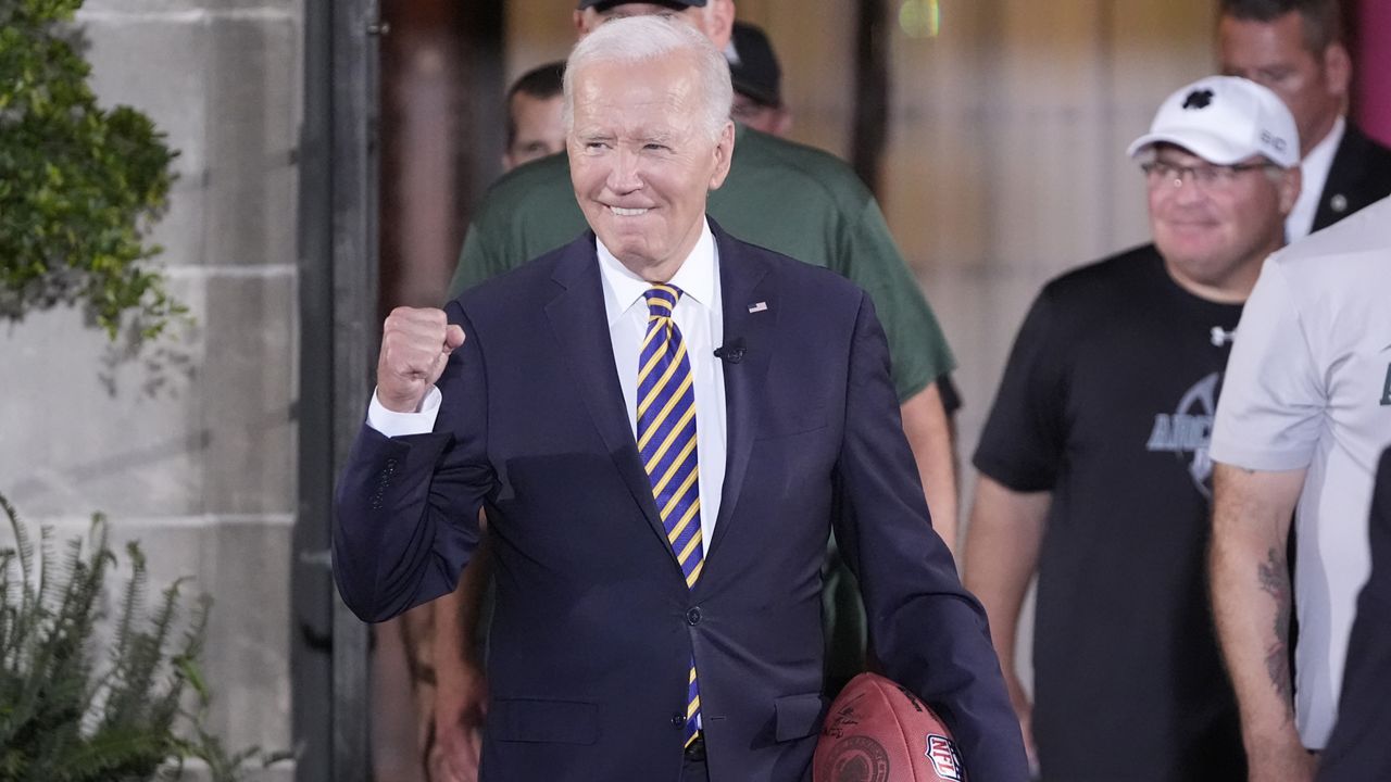 President Joe Biden's arrives and speaks with football players at Archmere Academy in Claymont, Del., Friday, Sept. 20, 2024, during a walkthrough visit ahead of his meetings with world leaders there on Saturday. (AP Photo/Mark Schiefelbein)