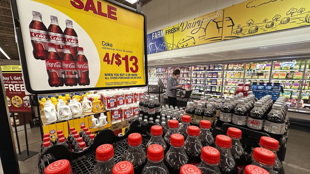 A customer passes an array of beverages while shopping at a grocery store in Chicago, Thursday, Sept. 19, 2024. (AP Photo/Nam Y. Huh)