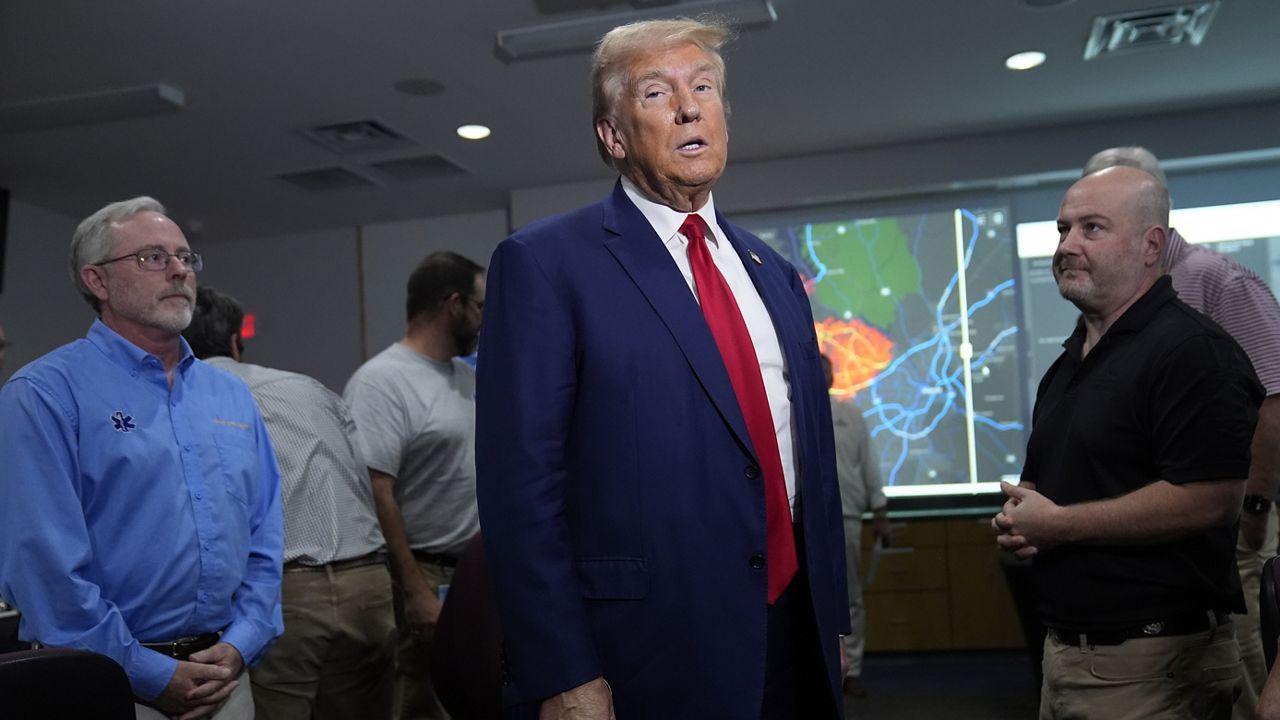 Republican presidential nominee former President Donald Trump arrives for a briefing at the Columbia County Emergency Management Agency as he visits areas impacted by Hurricane Helene, Friday, Oct. 4, 2024, in Evans, Ga. (AP Photo/Evan Vucci)