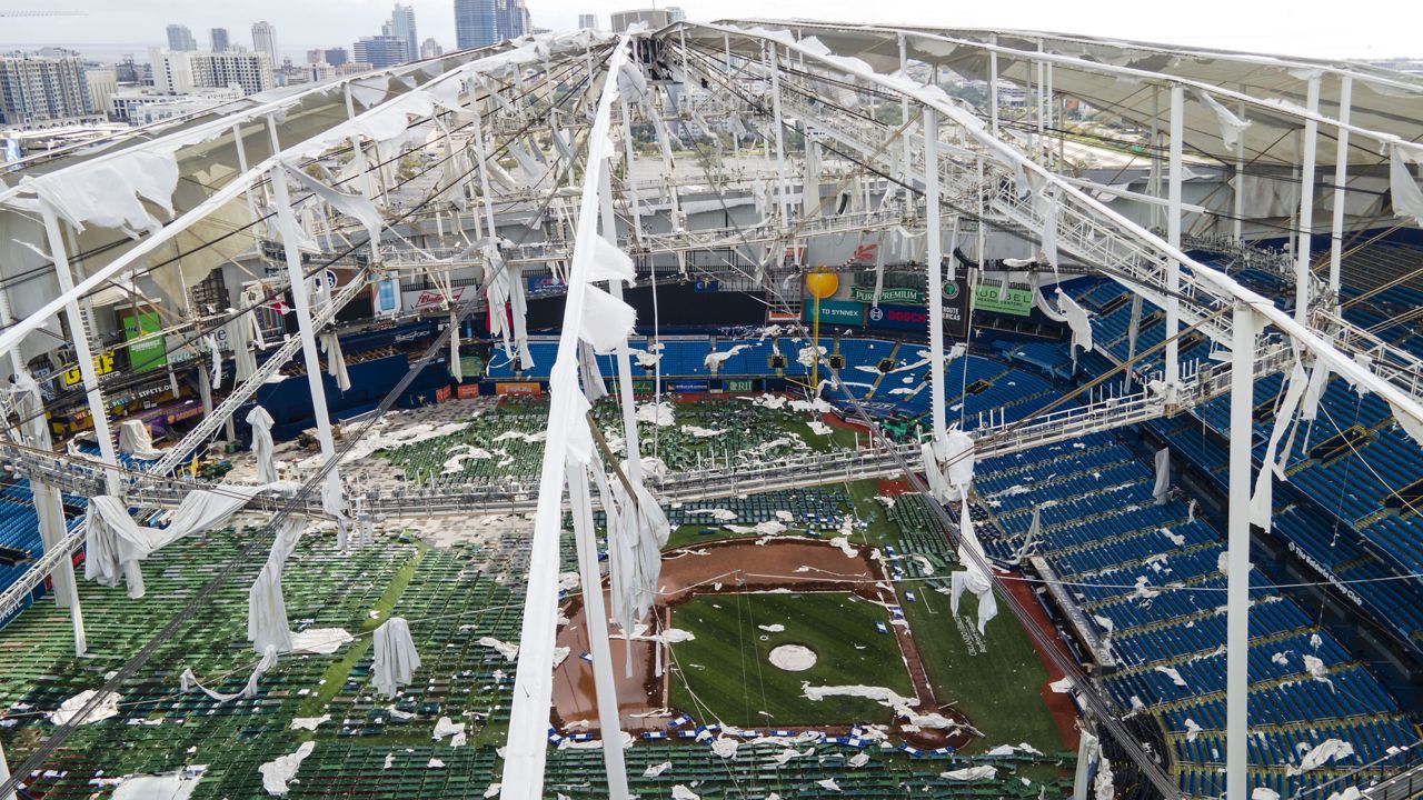 The roof of the Tropicana Field is damaged the morning after Hurricane Milton hit the region, Thursday, Oct. 10, 2024, in St. Petersburg, Fla. (AP Photo/Julio Cortez)