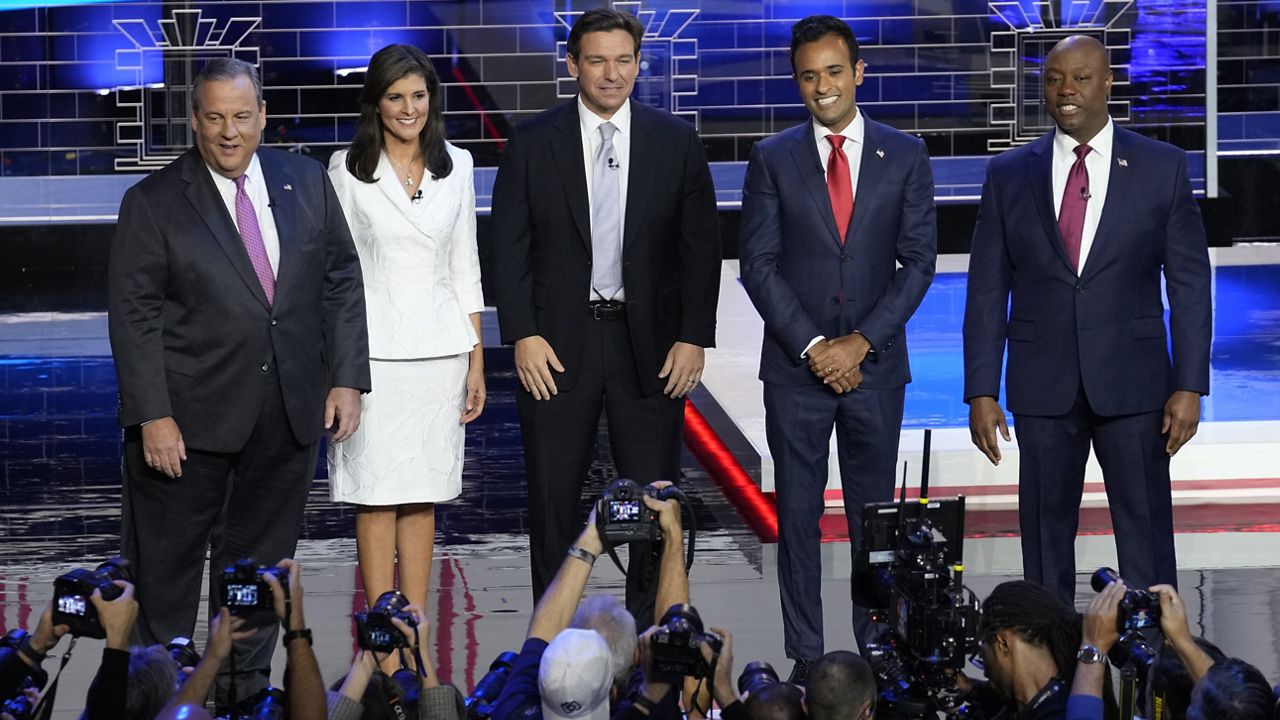 Former New Jersey Gov. Chris Christie, former UN Ambassador Nikki Haley, Florida Gov. Ron DeSantis, businessman Vivek Ramaswamy and Sen. Tim Scott, R-S.C., stand on stage before a Republican presidential primary debate hosted by NBC News, Wednesday, Nov. 8, 2023, at the Adrienne Arsht Center for the Performing Arts of Miami-Dade County in Miami. (AP Photo/Rebecca Blackwell)