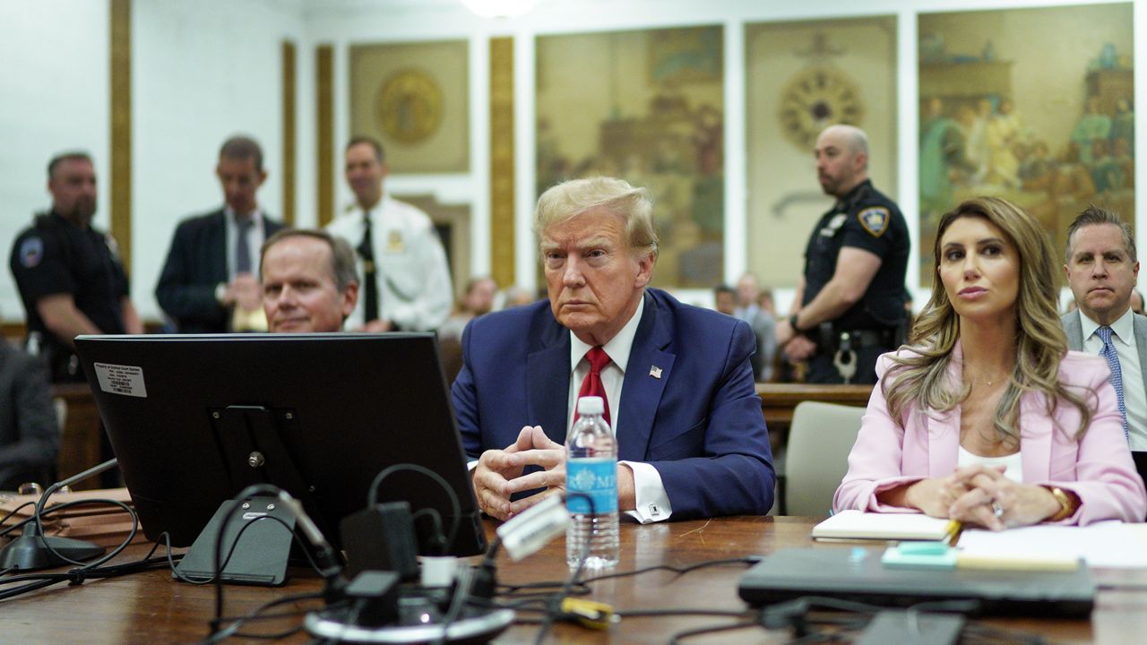 Former President Donald Trump, center, sits at the defense table with his attorney's Christopher Kise, left, and Alina Habba, at New York Supreme Court, Thursday, Dec. 7, 2023, in New York. (AP Photo/Eduardo Munoz Alvarez, Pool)