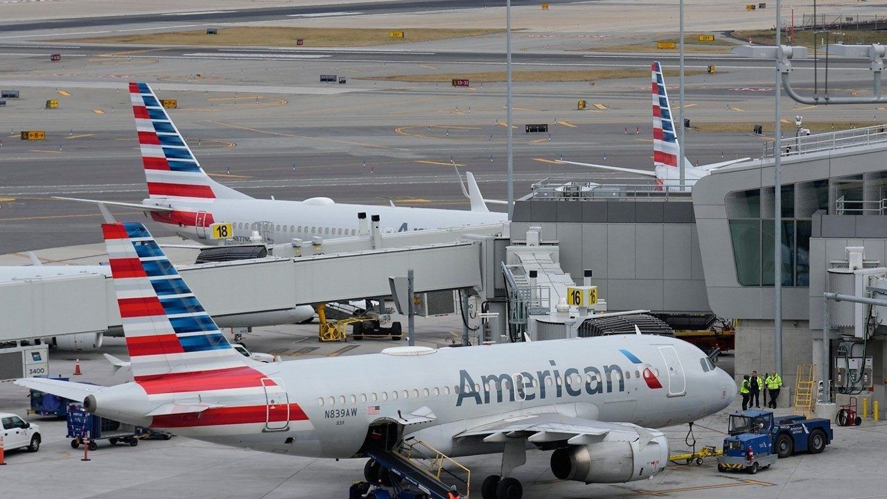 American Airlines planes sit on the tarmac at Terminal B at LaGuardia Airport, Jan. 11, 2023, in New York. (AP Photo/Seth Wenig)