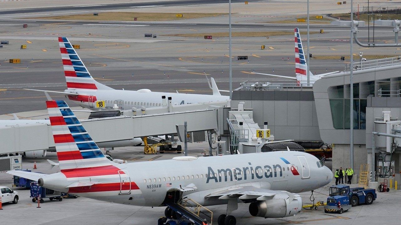 American Airlines planes sit on the tarmac at Terminal B at LaGuardia Airport on Jan. 11, 2023, in New York. (AP Photo/Seth Wenig)