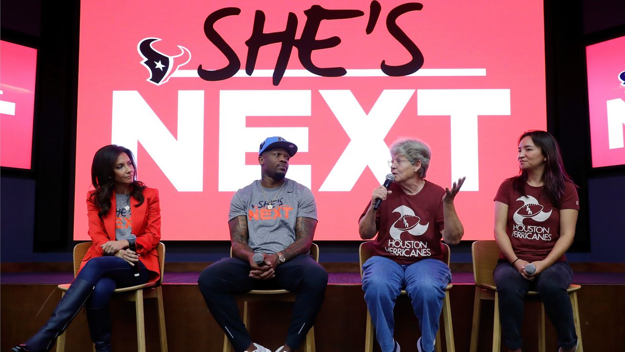 Panel members, from left, Hannah McNair, Texans co-owner; Andre Johnson, former Texan and NFL Hall-of-Famer; Marty Bryant, former Houston Herricanes player; and Olivia Kuan, director and producer, speak after an exclusive screening of the documentary "The Herricanes", about the Houston full-tackle women's football league team in the 70s, shown at NRG stadium in Houston. The Texans NFL team hosted the event with players from the era along with Texans legend players and current high school girls flag football players. (AP Photo/Michael Wyke)