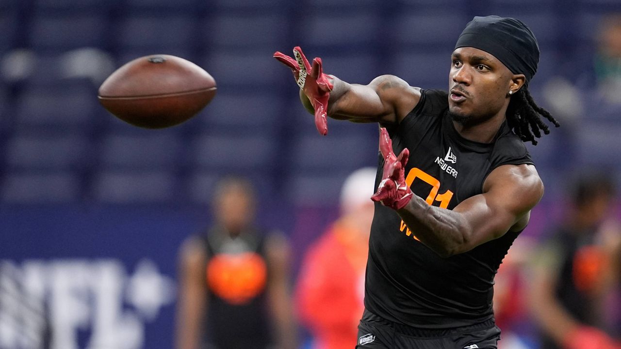 Arkansas wide receiver Andrew Armstrong runs a drill at the NFL football scouting combine in Indianapolis, Saturday, March 1, 2025. (AP Photo/George Walker IV)