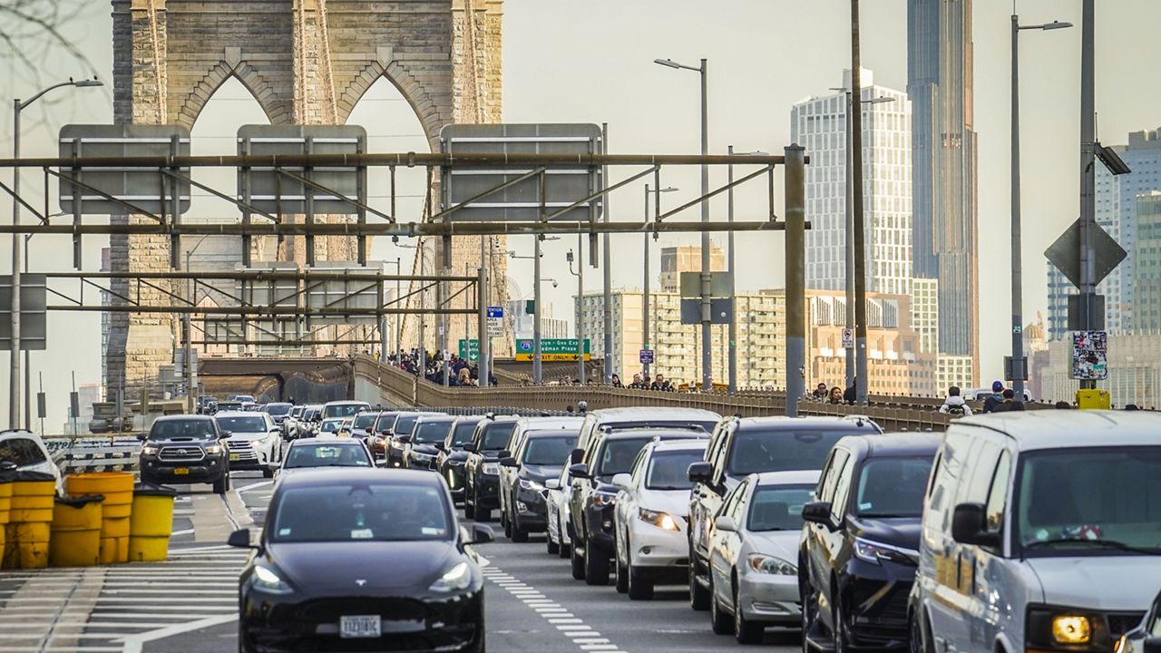 Traffic enters lower Manhattan after crossing the Brooklyn Bridge, Feb. 8, 2024, in New York. (AP Photo/Bebeto Matthews)