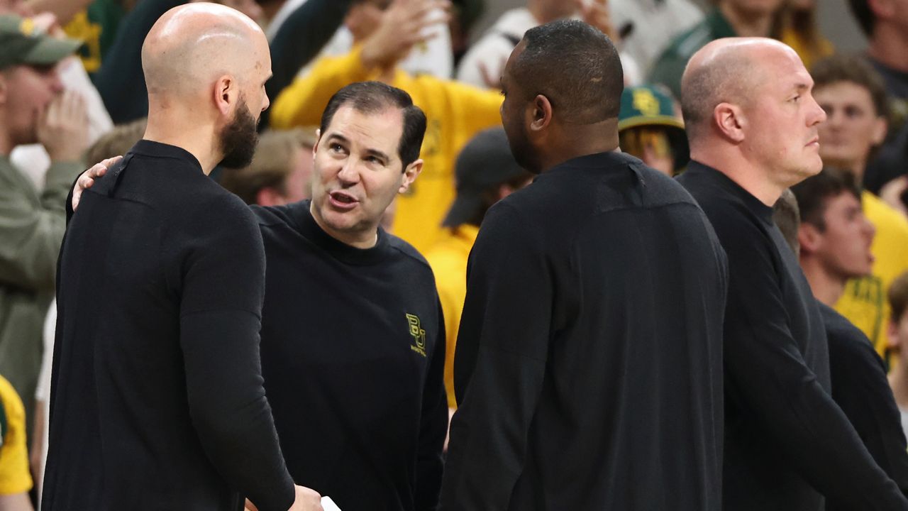 Baylor head coach Scott Drew, center, talks with his coaches after getting a second technical foul in the second half of an NCAA college basketball game against Iowa State, Saturday, Feb. 3, 2024, in Waco, Texas. (AP Photo/Rod Aydelotte)