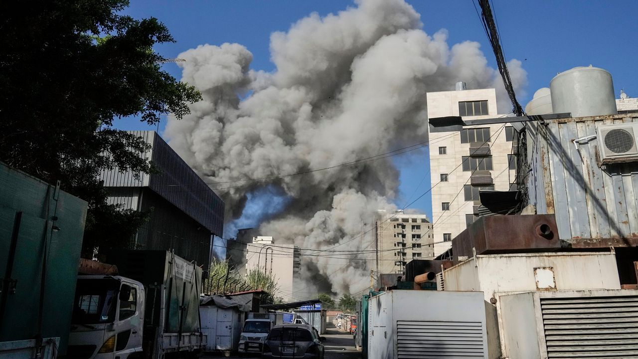 Smoke rises from a building that collapsed following an Israeli airstrike in Chiyah, south of Beirut, Lebanon, Sunday, Nov. 17, 2024. (AP Photo/Bilal Hussein)