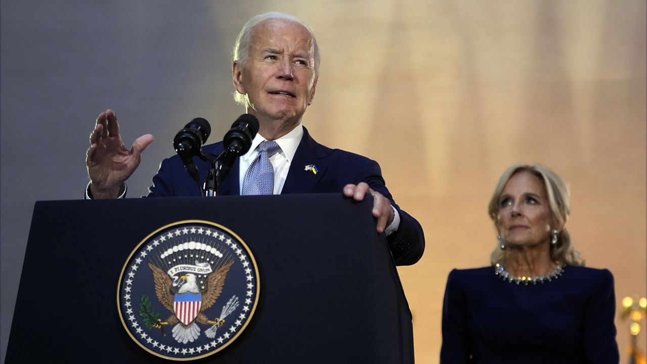 President Joe Biden speaks at a reception at the Metropolitan Museum of Art, Wednesday, Sept. 25, 2024, in New York, as first lady Jill Biden listens. (AP Photo/Manuel Balce Ceneta)