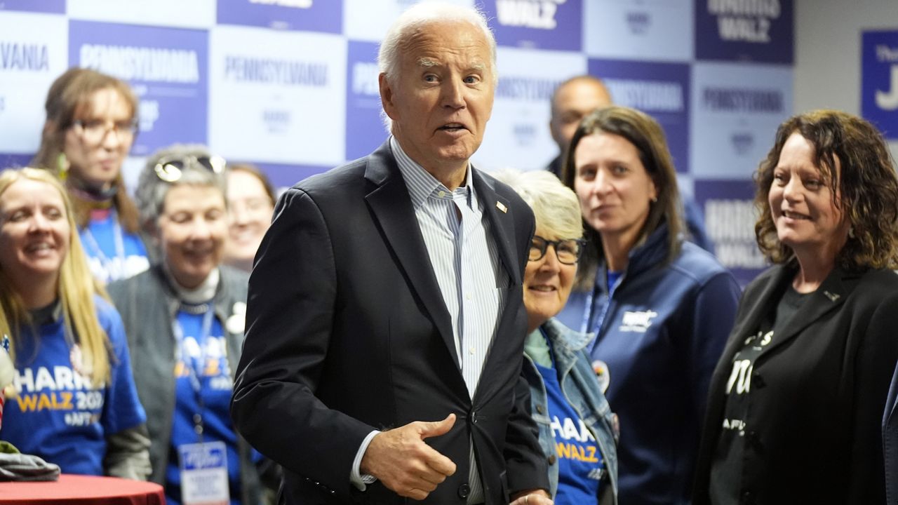 President Joe Biden talks with volunteers at a campaign office in Scranton, Pa., Saturday, Nov. 2, 2024. (AP Photo/Manuel Balce Ceneta)