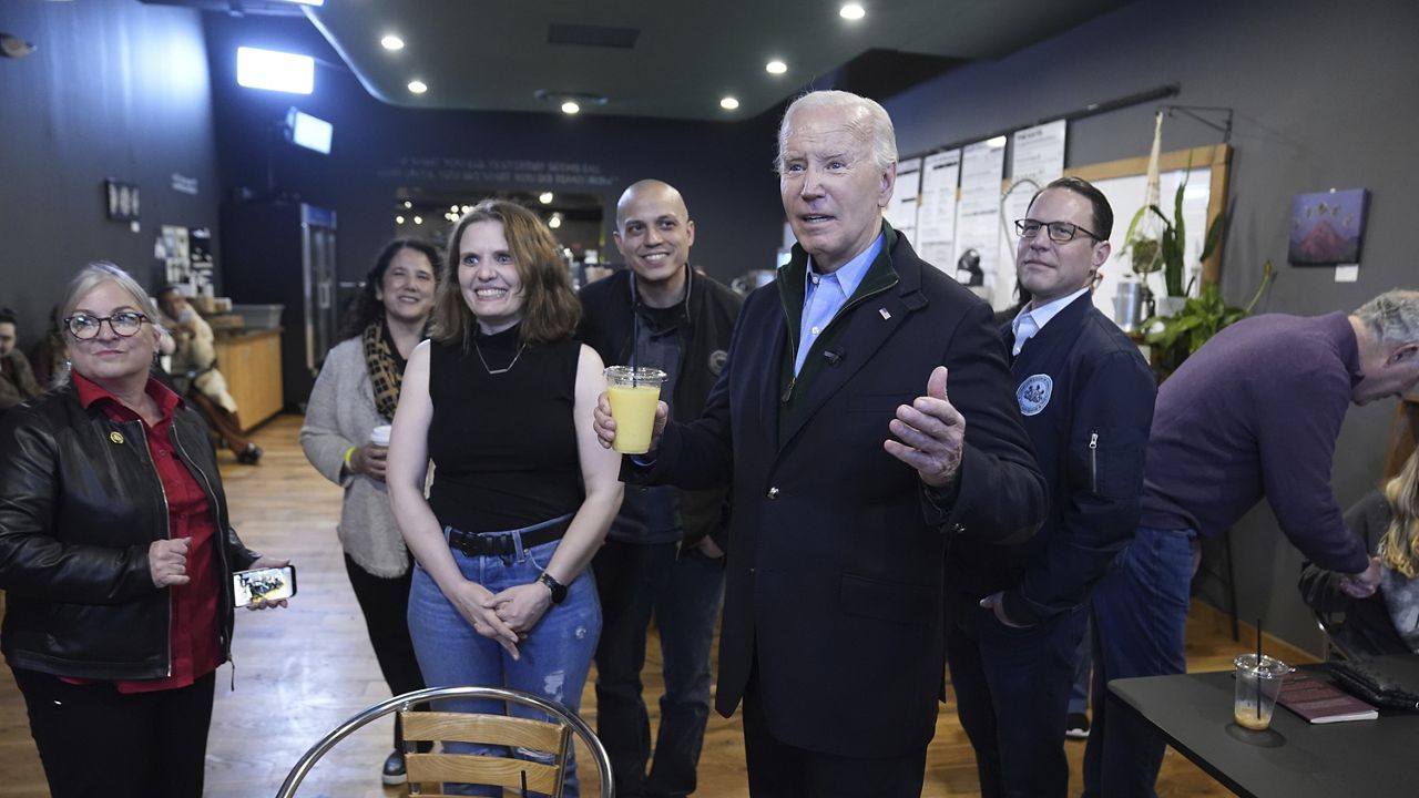 President Joe Biden talks about his economic agenda, during a visit to the Nowhere Coffee shop, Friday, Jan. 12, 2024, in Emmaus, Pa., with Lauren Vargas, Co-Owner and President. (AP Photo/Evan Vucci)