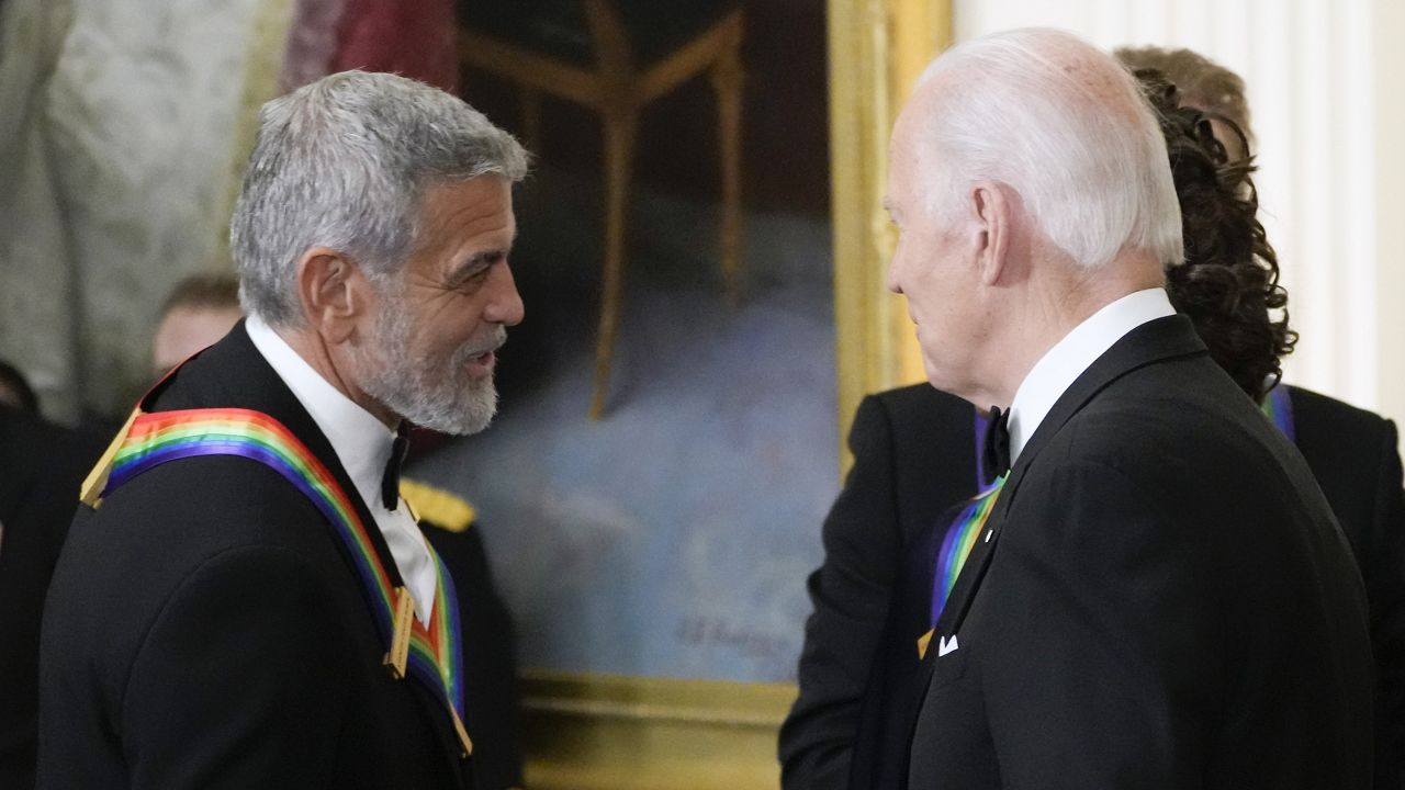 President Joe Biden shakes hands with actor, director and producer George Clooney during the Kennedy Center honorees reception at the White House in Washington, Dec. 4, 2022. (AP Photo/Manuel Balce Ceneta)