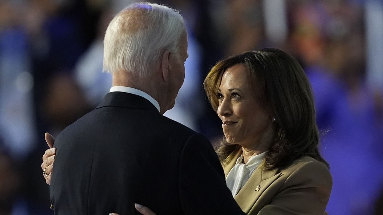 Democratic presidential nominee Vice President Kamala Harris hugs President Biden during the Democratic National Convention Monday, Aug. 19, 2024, in Chicago. (AP Photo/Charles Rex Arbogast)