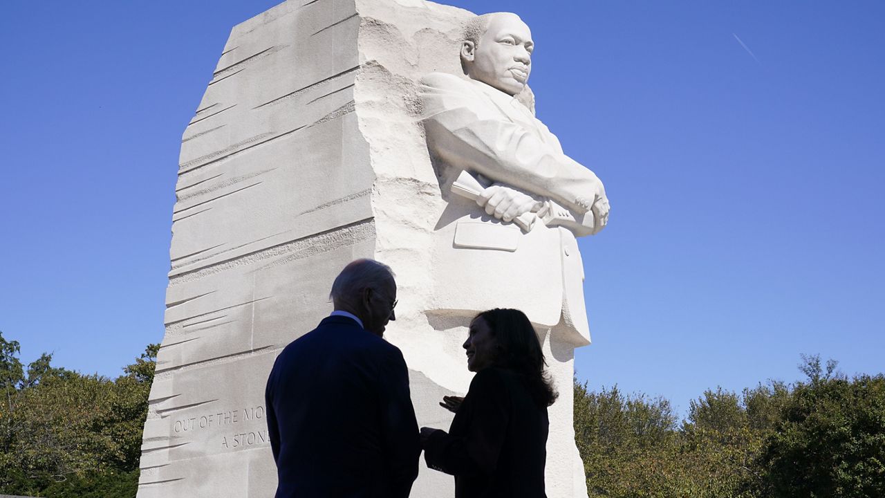 President Joe Biden and Vice President Kamala Harris stand together at the Martin Luther King, Jr. Memorial as they arrive to attend an event marking the 10th anniversary of the dedication of memorial in Washington, Thursday, Oct. 21, 2021. (AP Photo/Susan Walsh)