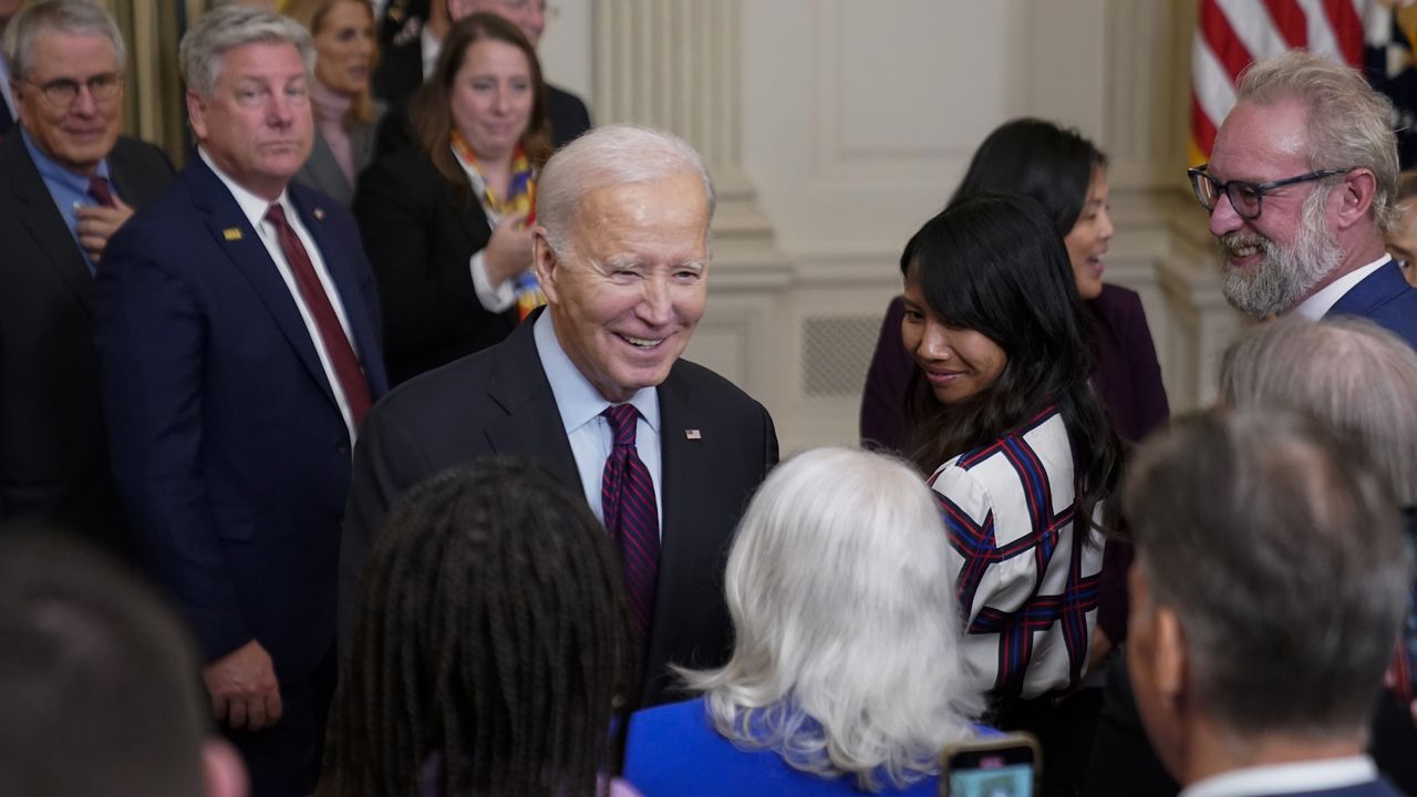 President Joe Biden greets guests after speaking during an event on protecting retirement security against what are commonly referred to as "junk fees" in the State Dining Room of the White House, Tuesday, Oct. 31, 2023, in Washington. (AP Photo/Andrew Harnik)