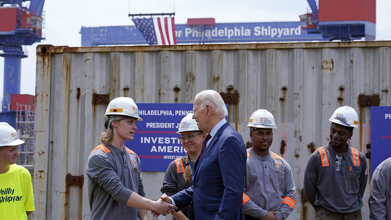President Joe Biden greets workers as he tours a shipyard in Philadelphia, Thursday, July 20, 2023. Biden is visiting the shipyard to push for a strong role for unions in tech and clean energy jobs. (AP Photo/Susan Walsh)