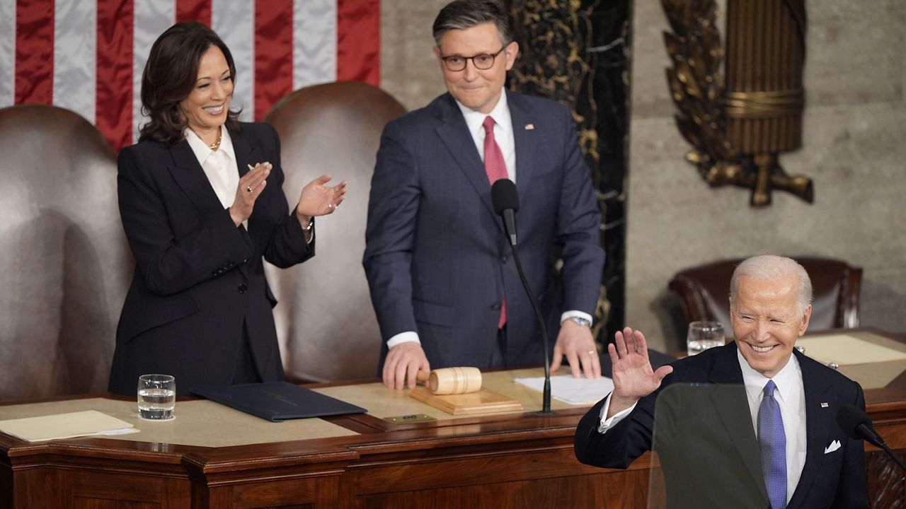 President Joe Biden arrives for the State of the Union address on Capitol Hill, Thursday, March 7, 2024, in Washington, as Vice President Kamala Harris and House Speaker Mike Johnson of La., watch. (AP Photo/Mark Schiefelbein)