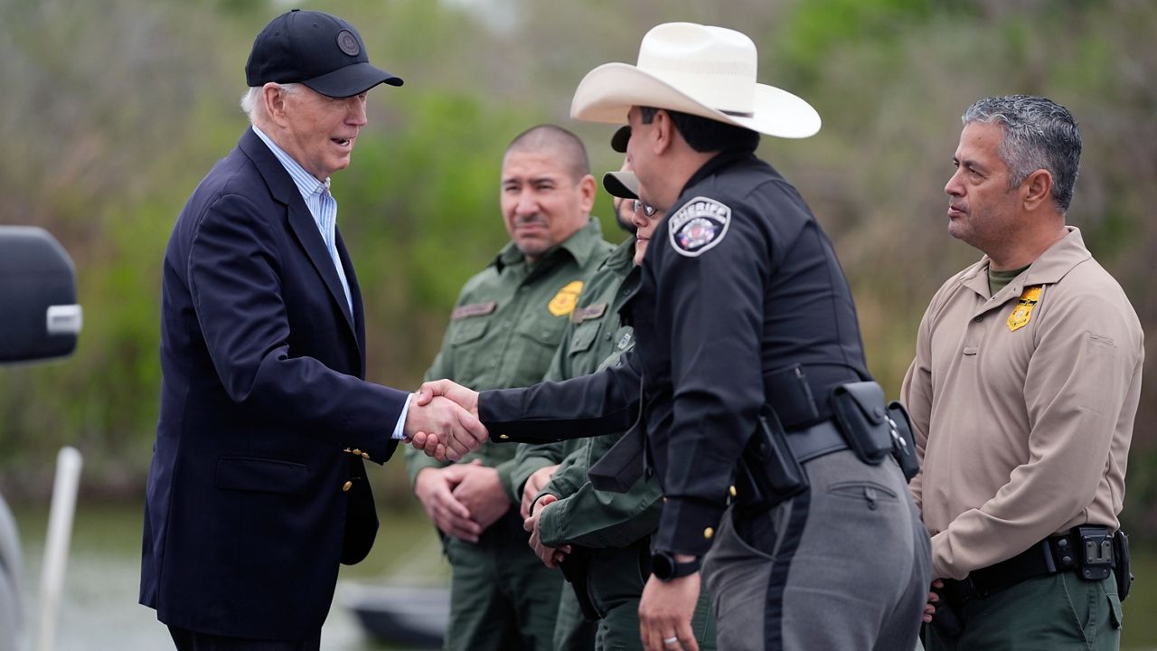 President Joe Biden talks with the U.S. Border Patrol and local officials as he looks over the southern border, Feb. 29, 2024, in Brownsville, Texas, along the Rio Grande. (AP Photo/Evan Vucci)