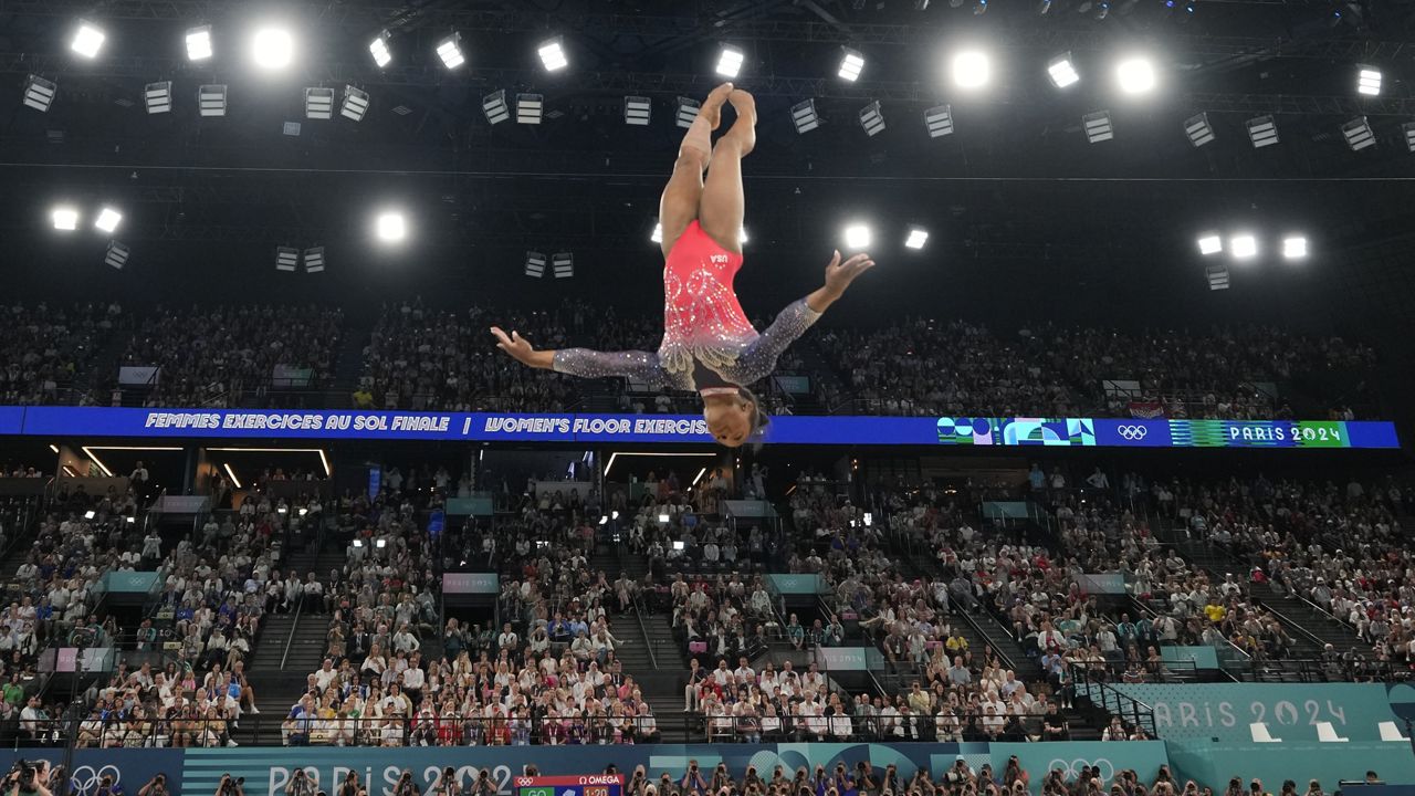 Simone Biles, of the United States, competes during the women's artistic gymnastics individual floor finals at Bercy Arena at the 2024 Summer Olympics, Monday, Aug. 5, 2024, in Paris, France. (AP Photo/Abbie Parr)