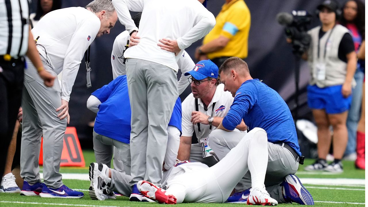 Buffalo Bills quarterback Josh Allen is looked at by trainers after getting injured during the second half of an NFL football game against the Houston Texans, Sunday, Oct. 6, 2024, in Houston. (AP Photo/Eric Christian Smith)