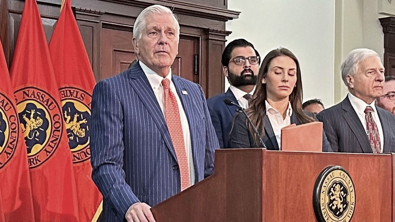 Nassau County Executive Bruce Blakeman, at podium, speaks during a news conference in Mineola, N.Y., Wednesday, March 6, 2024. (AP Photo/Philip Marcelo)