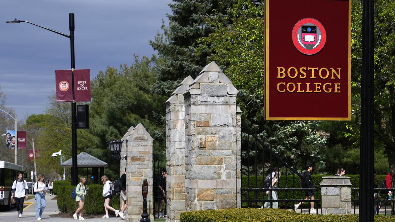 Students walk on the campus of Boston College, Monday, April 29, 2024, in Boston. While many colleges and universities in the Boston area have been scenes of encampments and arrests, Boston College has been relatively quiet. (AP Photo/Charles Krupa)