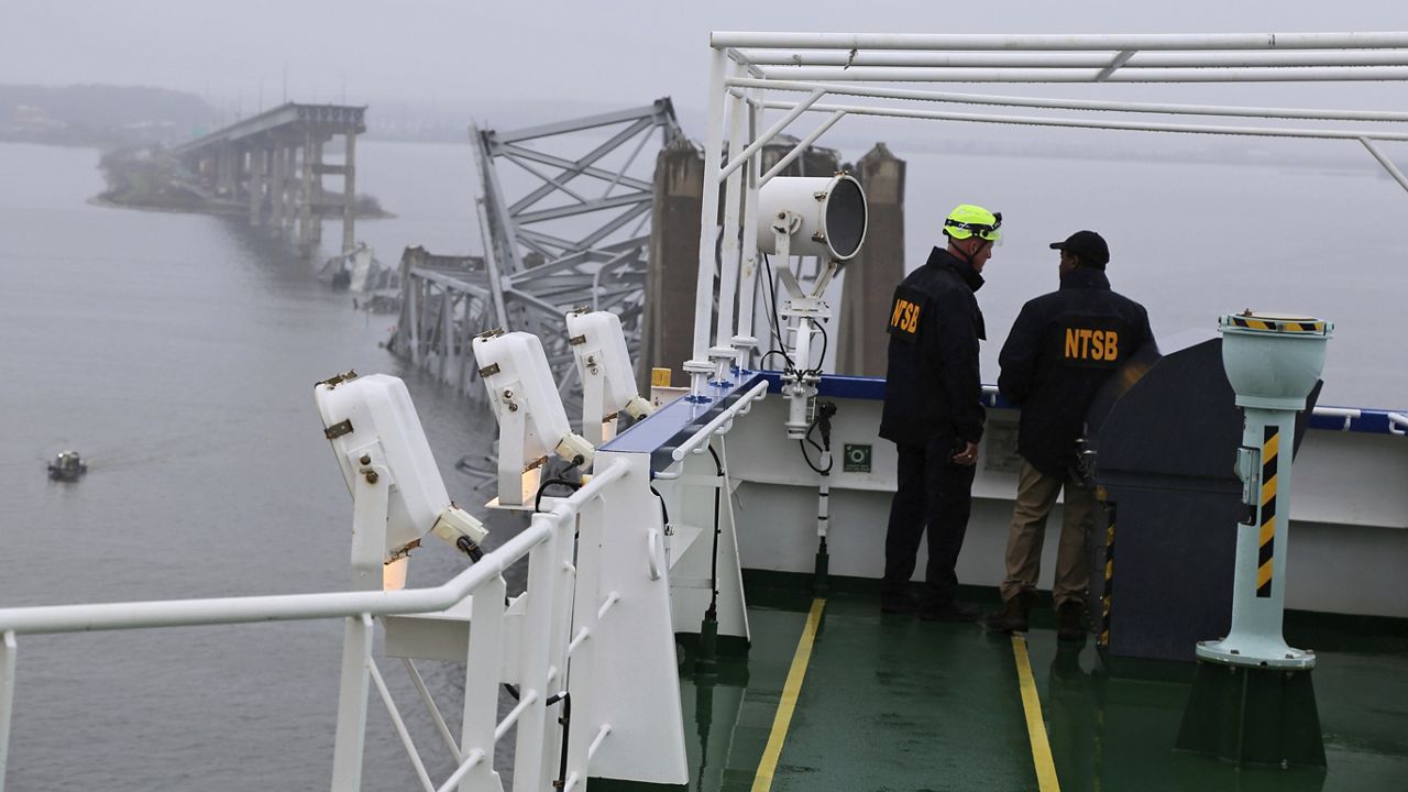 In this image released by the National Transportation and Safety Board, NTSB investigators on the cargo vessel Dali, which struck and collapsed the Francis Scott Key Bridge, Wednesday, March 27, 2024 in Baltimore. (Peter Knudson/NTSB via AP)