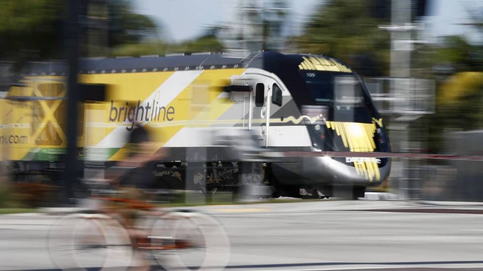 In this Wednesday, Nov. 27, 2019 file photo, a Brightline passenger train passes by in Oakland Park, Fla. Florida’s high-speed passenger train service suffered the first fatality on its new extension between West Palm Beach and Orlando on Thursday, Sept. 28 2023 when a pedestrian was struck. Overall, it was Brightline’s 99th death since it began operations six years ago. (AP Photo/Brynn Anderson, file)