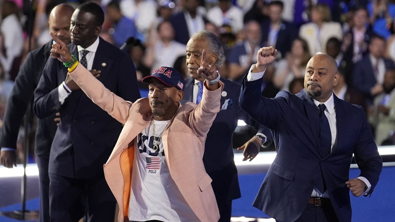 The Central Park Five join Reverend Al Sharpton during the Democratic National Convention, Aug. 22, 2024, in Chicago. (AP Photo/Charles Rex Arbogast)