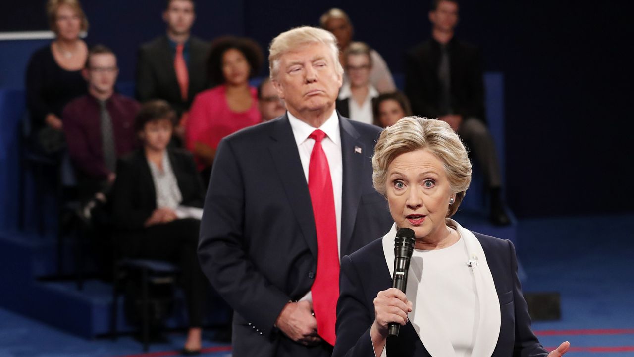 Democratic presidential nominee Hillary Clinton, right, speaks as Republican presidential nominee Donald Trump listens during the second presidential debate in St. Louis, Oct. 9, 2016. (Rick T. Wilking/Pool via AP)