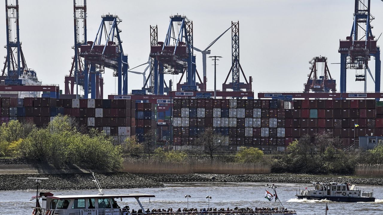 Port cranes load container ships at the import and export harbor in Hamburg, Germany, Tuesday, March 19, 2022. (AP Photo/Martin Meissner)