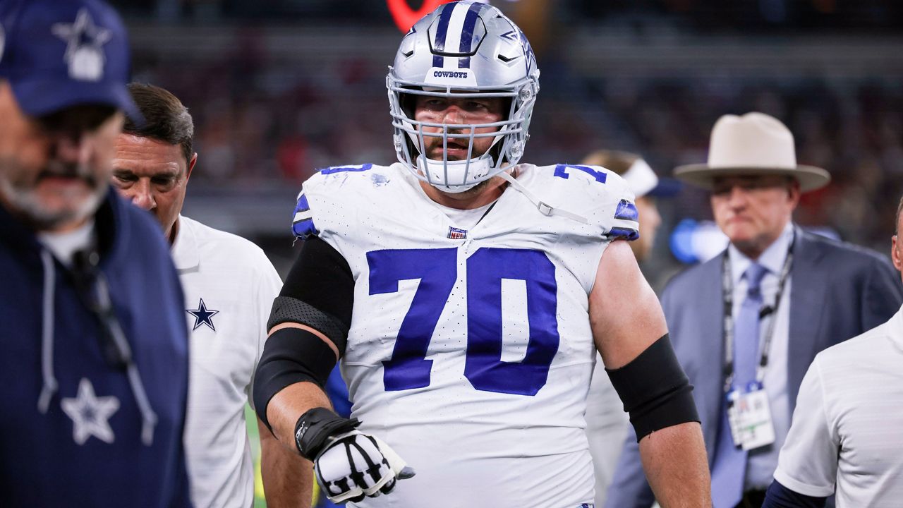 Dallas Cowboys guard Zack Martin (70) is helped off the field following an injury in an NFL football game against the Houston Texans in Arlington, Texas, Monday, Nov. 18, 2024. (AP Photo/Gareth Patterson, File)