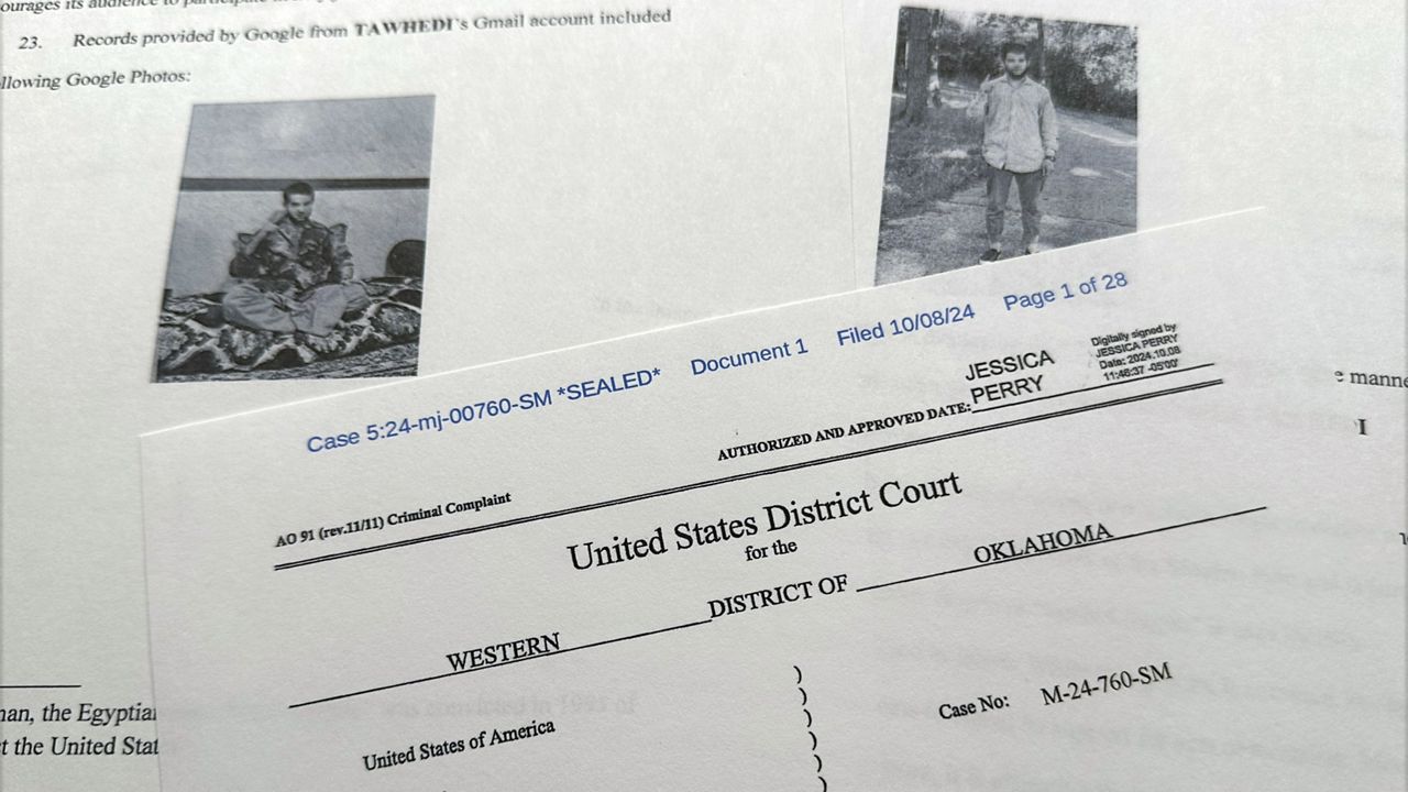 The criminal complaint, filed by the Justice Department, against Nasir Ahmad Tawhedi, 27, of Oklahoma City is photographed Tuesday, Oct. 8, after the FBI arrested the man who officials say was inspired by the Islamic State militant organization and was plotting an Election Day attack targeting large crowds in the U.S. (AP Photo/Jon Elswick)