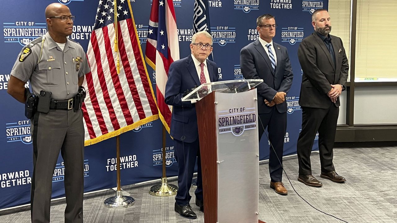 Ohio Gov. Mike DeWine (R) speaks at a press conference at Springfield City Hall alongside Ohio State Highway Patrol Colonel Charles Jones, left, Director of the Department of Public Safety Andy Wilson, second from right, and Springfield City School Superintendent Robert Hill, right, in Springfield, Ohio, Monday, Sept. 16, 2024. (AP Photo/Patrick Aftoora-Orsagos)