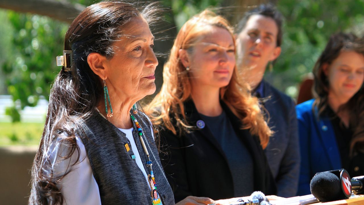 U.S. Interior Secretary Deb Haaland, left, is flanked by U.S. Rep. Melanie Stansbury, D-N.M., and state and local water officials during a news conference in Albuquerque, N.M., Friday, May 10, 2024. Haaland announced the federal government is dedicating $60 million for conservation projects along the Rio Grande, marking the first distribution of funding under the Inflation Reduction Act for a basin outside of the Colorado River system. (AP Photo/Susan Montoya Bryan)