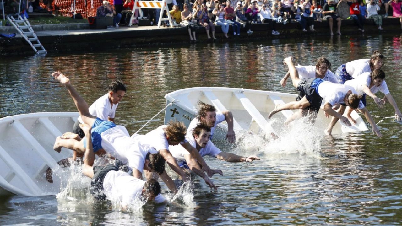 Cross divers leap into the waters of Spring Bayou during the 2024 Epiphany cross dive in Tarpon Springs. (Associated Press via Jefferee Woo/Tampa Bay Times)