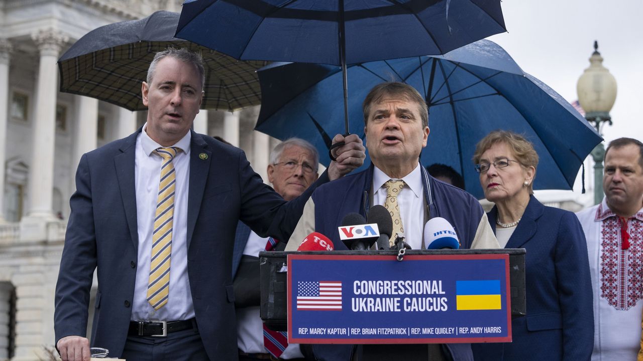 Co-chairs of the Congressional Ukraine Caucus Rep. Brian Fitzpatrick, R-Pa., front left, Rep. Mike Quigley, D-Ill., and Rep. Marcy Kaptur, D-Ohio, along with Sen. Roger Wicker, R-Miss., in second row at right of Fitzpatrick, attend a news conference, Tuesday, Jan. 31, 2023, about the war in Ukraine, on Capitol Hill in Washington. (AP Photo/Jacquelyn Martin)