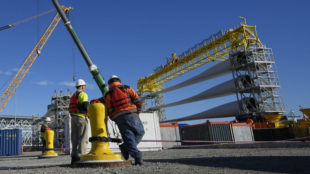 A generator and its blades are prepared to head to the open ocean for the South Fork Wind farm from State Pier in New London, Conn., Dec. 4, 2023. (AP Photo/Seth Wenig)