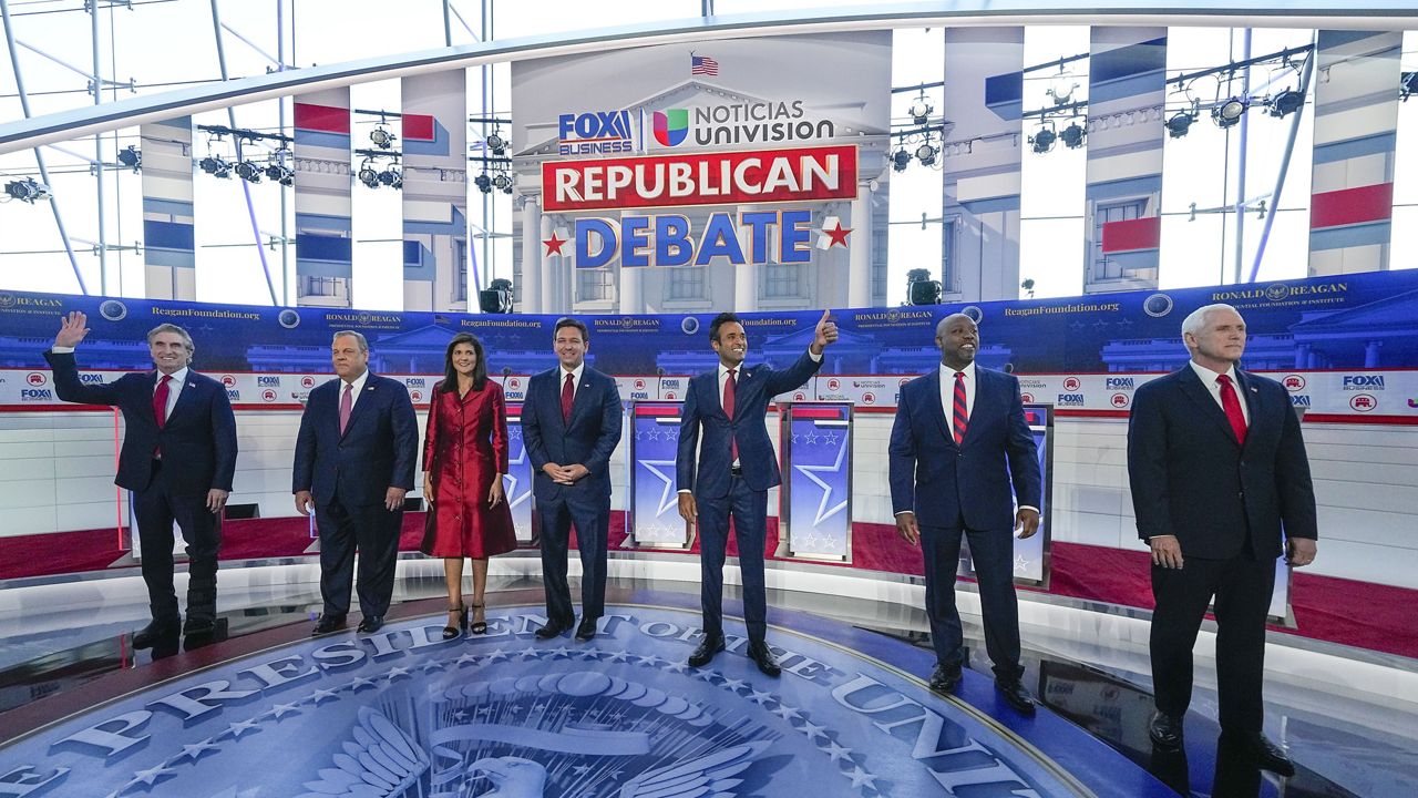 Republican presidential candidates, from left, North Dakota Gov. Doug Burgum, former New Jersey Gov. Chris Christie, former U.N. Ambassador Nikki Haley, Florida Gov. Ron DeSantis, entrepreneur Vivek Ramaswamy, Sen. Tim Scott, R-S.C., and former Vice President Mike Pence, before the start of a Republican presidential primary debate hosted by FOX Business Network and Univision, Wednesday, Sept. 27, 2023, at the Ronald Reagan Presidential Library in Simi Valley, Calif. (AP Photo/Mark Terrill)