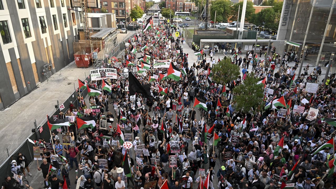 Protesters march during a demonstration outside the Democratic National Convention Wednesday, Aug. 21, 2024, in Chicago. (AP Photo/Noah Berger)