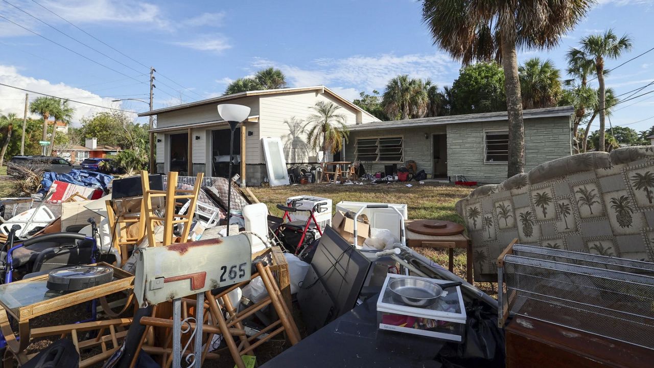 The contents of the house of Marjorie Havard, who was found deceased in the home, rests in a pile, Wednesday, Oct. 2, 2024, in Indian Rocks Beach, Fla. (AP/Mike Carlson)