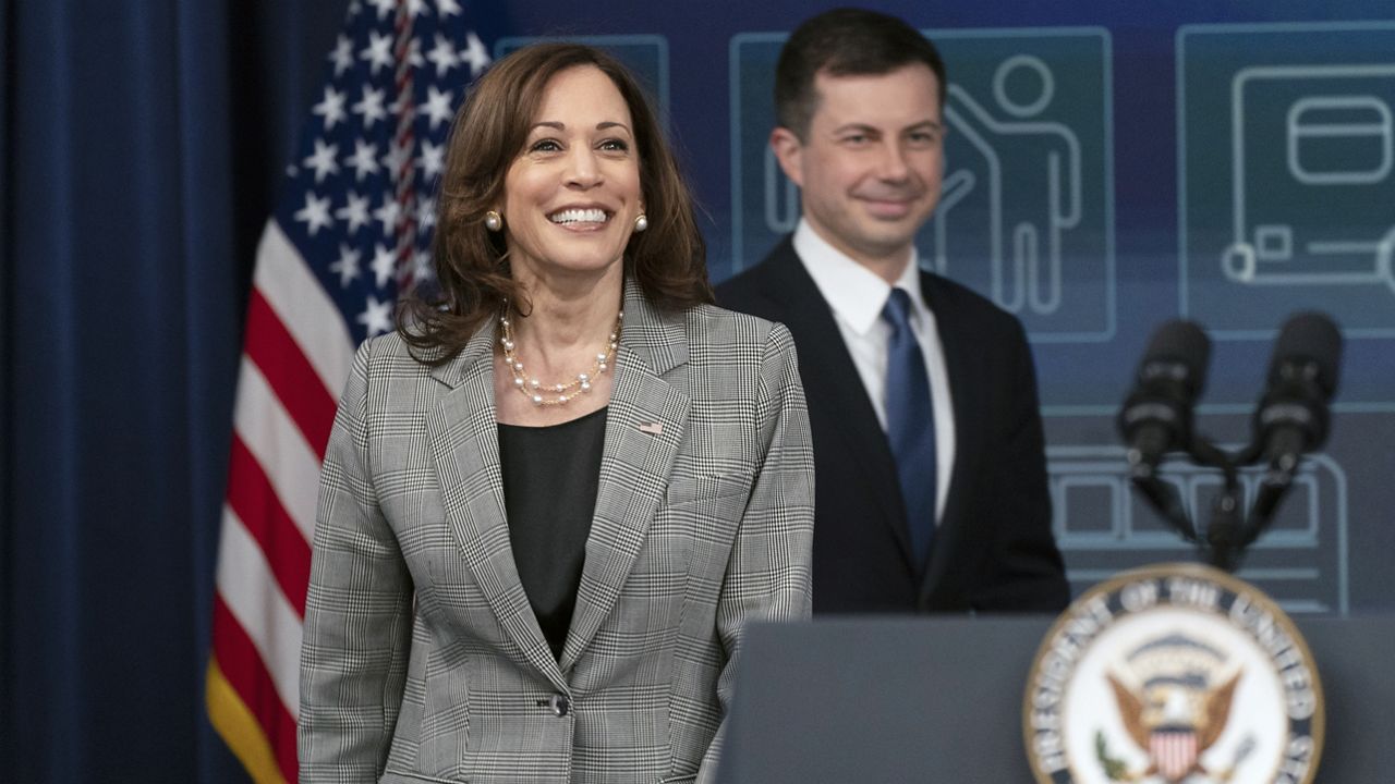 Vice President Kamala Harris followed by Secretary of Transportation Pete Buttigieg, arrives at the Eisenhower Executive Office Building on the White House complex, in Washington, Monday, March 7, 2022. (AP Photo/Manuel Balce Ceneta)