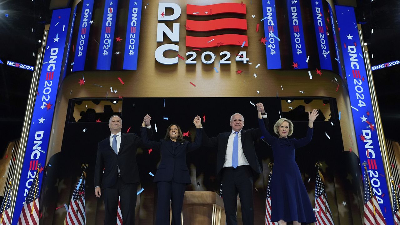 Democratic presidential nominee Vice President Kamala Harris and second gentleman Doug Emhoff stand on stage with Democratic vice presidential candidate Minnesota Gov. Tim Walz and his wife Gwen Walz at Democratic National Conventionat the United Center in Chicago, Thursday, Aug. 22, 2024. (Mike Segar/Pool via AP)