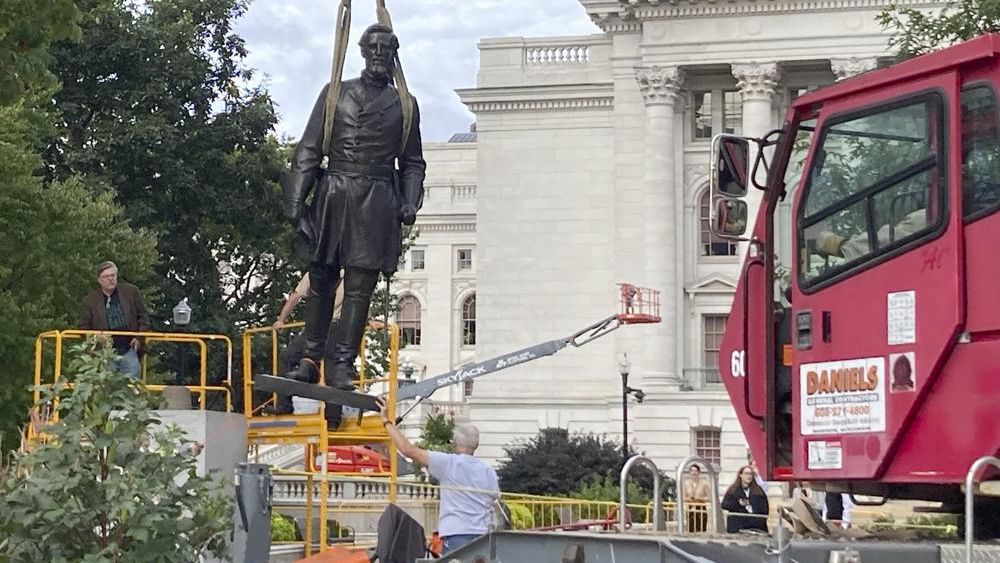 Workers reinstall Wisconsin statues downed in 2020 protest